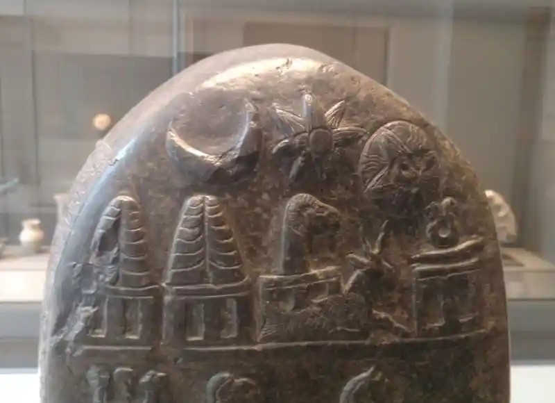 Cross with rays on a babylonian stele